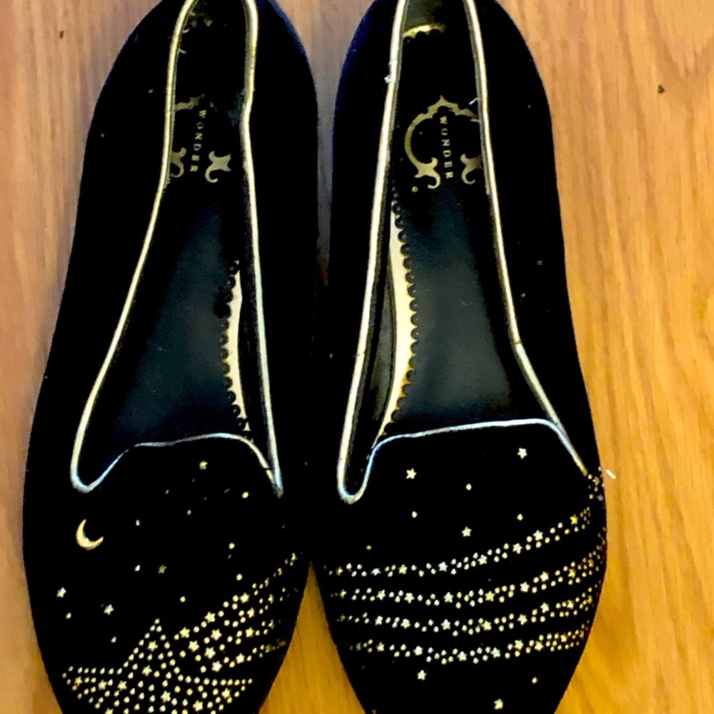 Beautiful shooting star, black and gold C Wonder loafers.